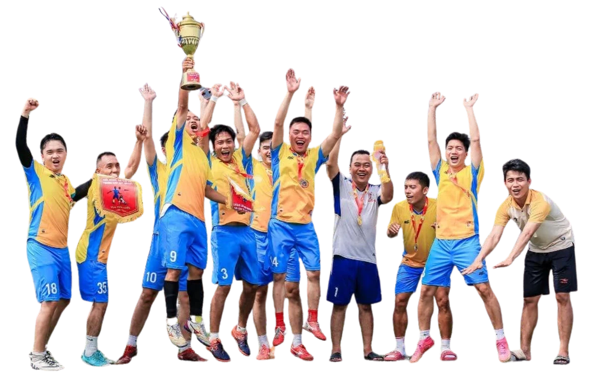 The MIMA football team cheering with the championship trophy